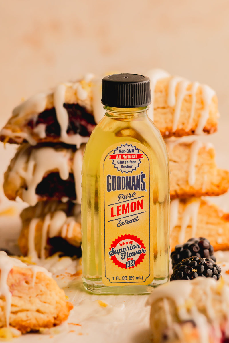 Bottle of Goodman's Pure Lemon Extract with pastries in the background