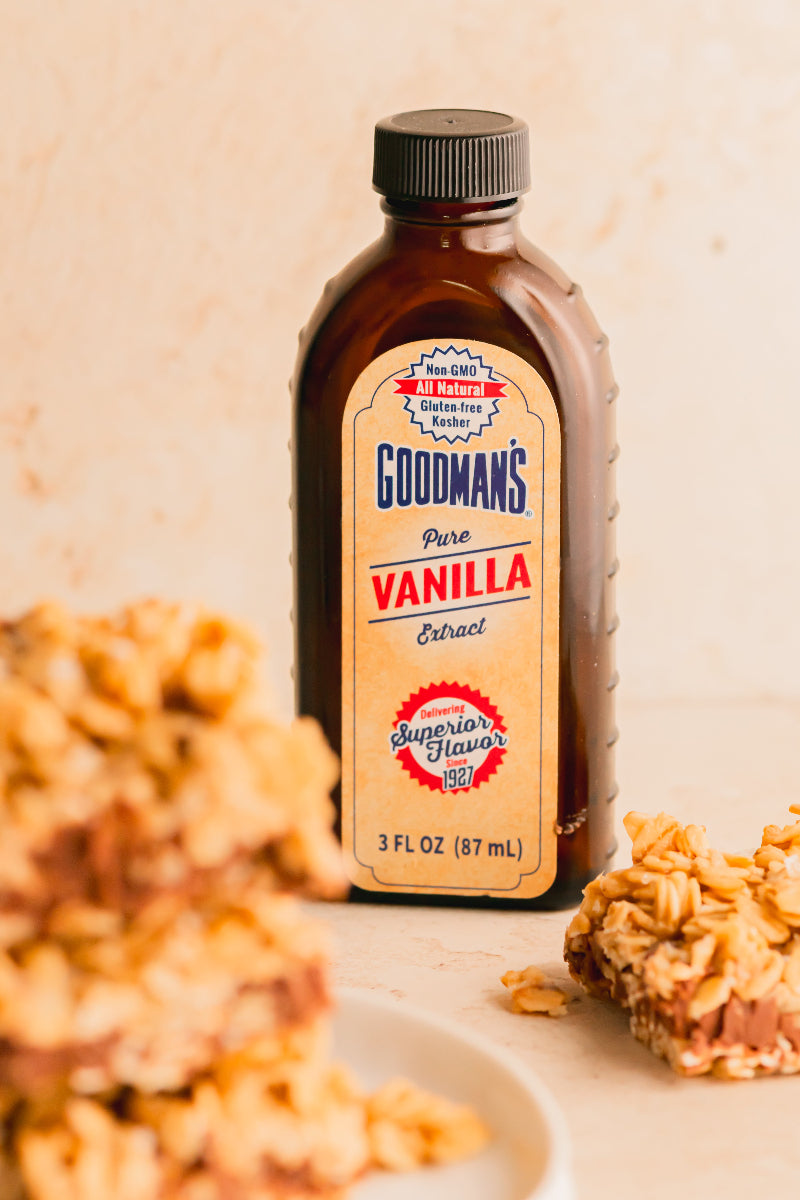 Goodman's Pure Vanilla Extract bottle with granola bars in the background