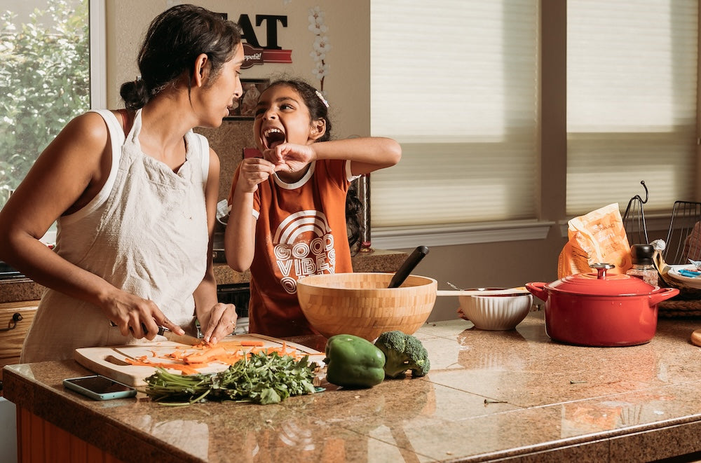 Mom_and_daughter_while_laughing_together_in_the_kitchen