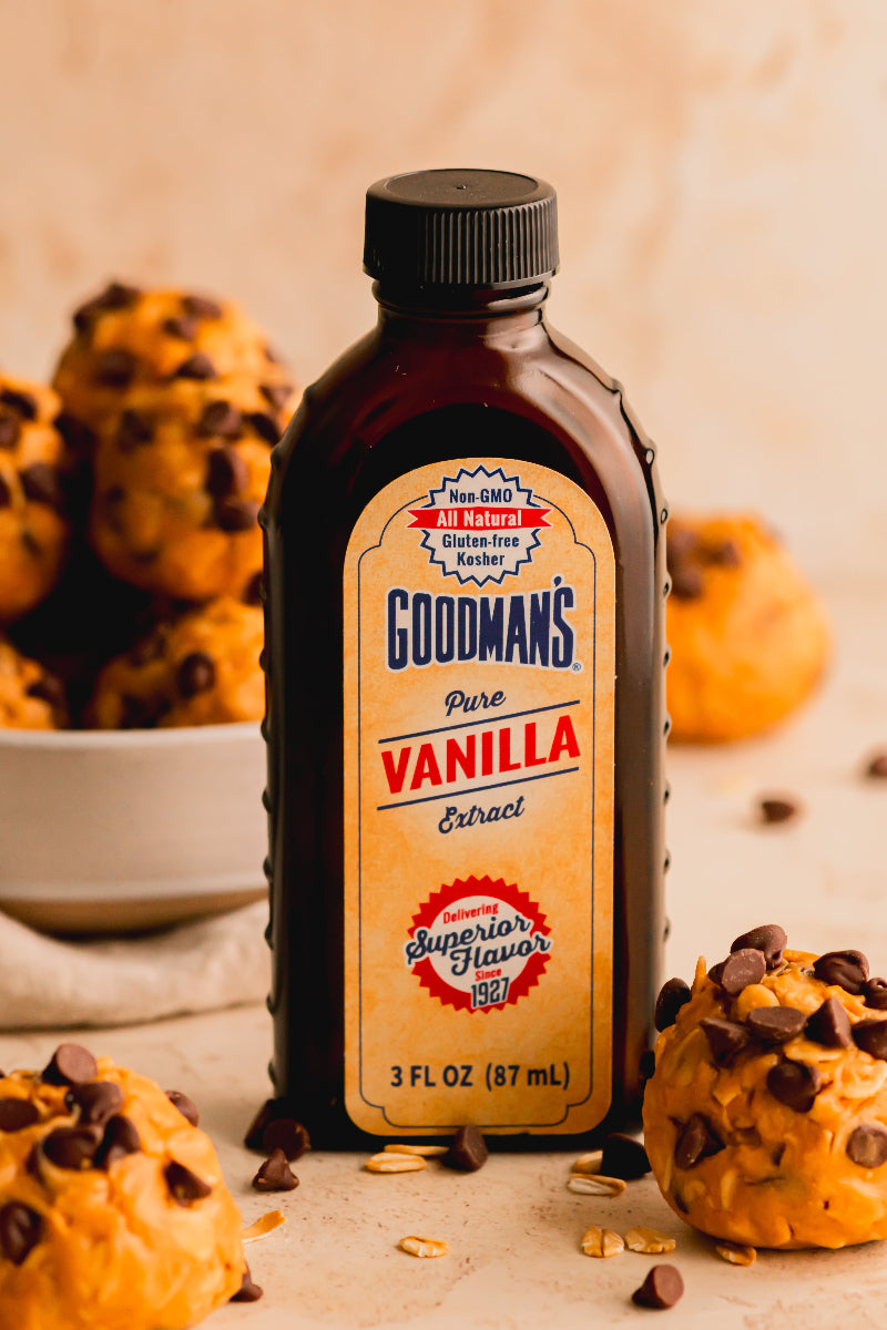 Bottle of Goodman's Pure Vanilla Extract with muffins in the background