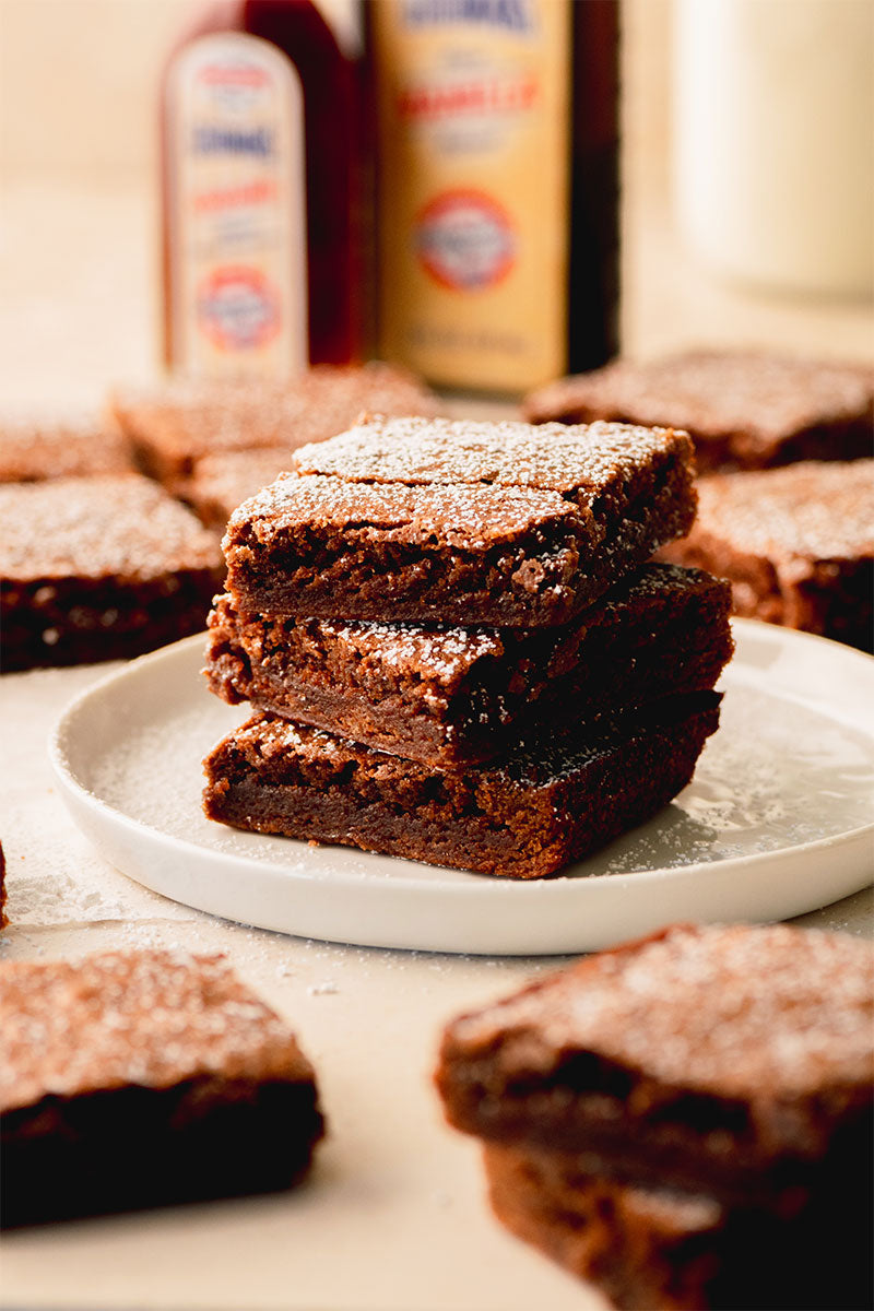 Stack of 3 Aunt Norma's Brownies on a Plate with Powedered Sugar