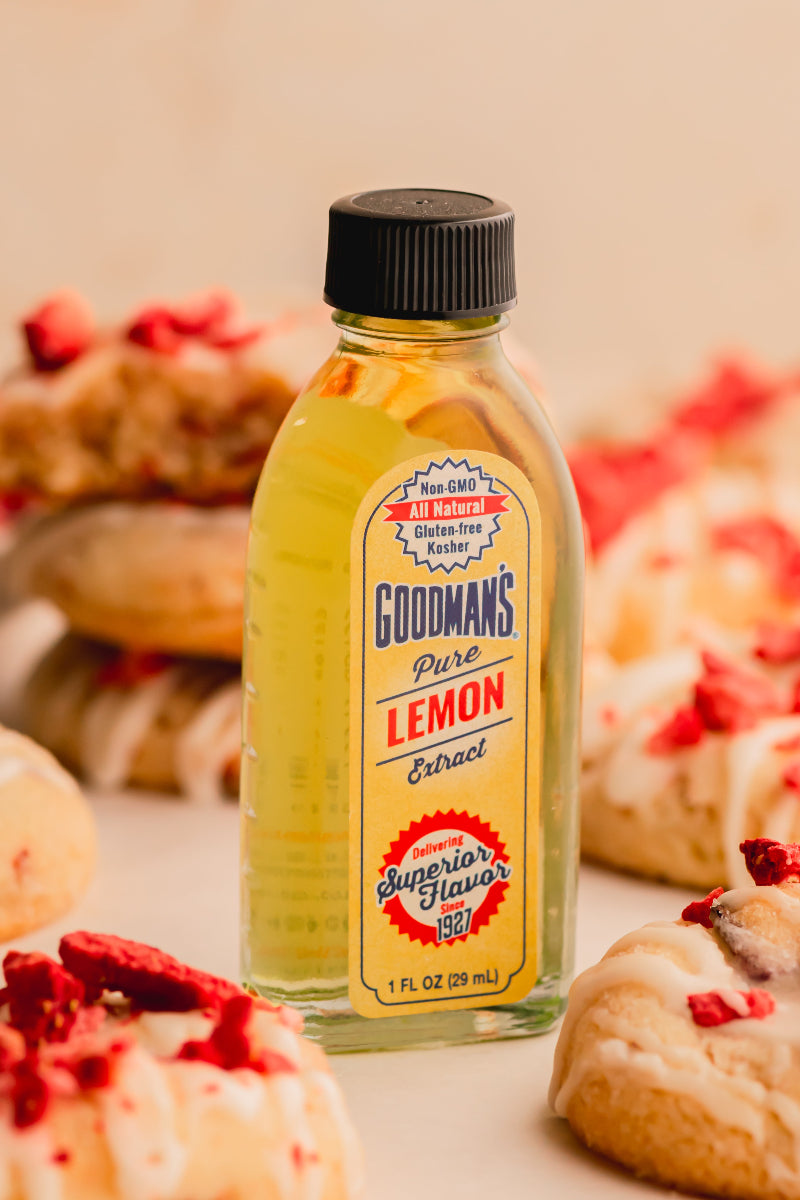 Bottle of Goodman's Pure Lemon Extract with pastries in the background