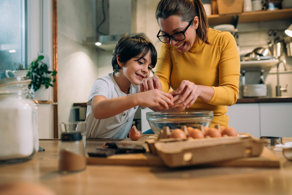 mother_and_her_son_preparing_food_in_kitchen